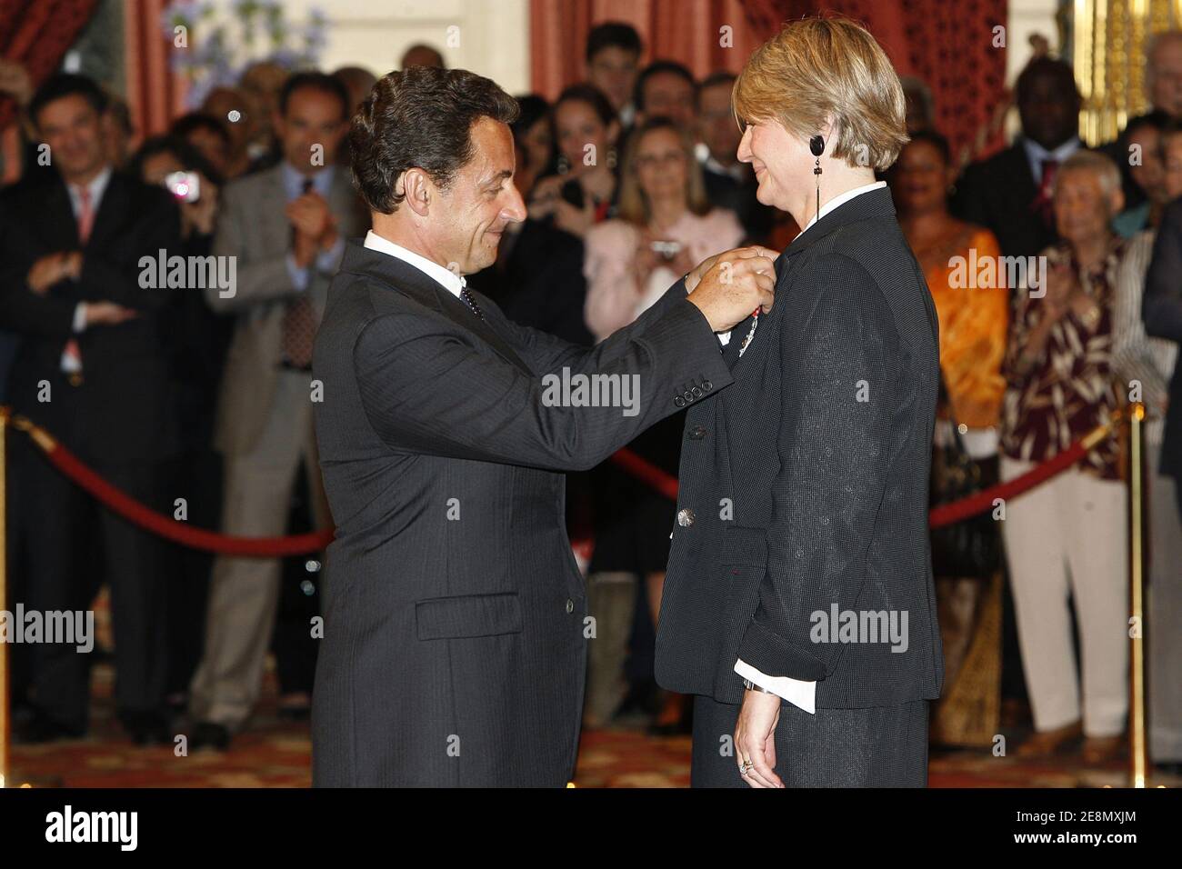 French president Nicolas Sarkozy awards Sophie Devedjian, head of cabinet of Anthony's mayor as officer of France's Legion d'Honneur order (legion of honnor) at the Elysee Palace in Paris, France on July 13, 2007. Photo by Bernard Bisson/ABACAPRESS.COM Stock Photo