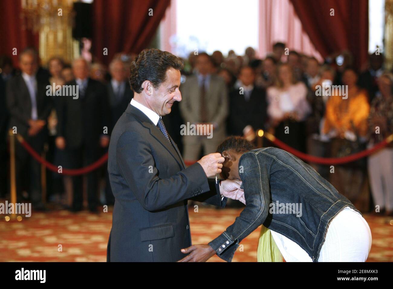 French president Nicolas Sarkozy awards Former Somalian top model and UN special ambassador Waris Dirie as officer of France's Legion d'Honneur order (legion of honnor) at the Elysee Palace in Paris, France on July 12, 2007. Photo by Bernard Bisson/ABACAPRESS.COM Stock Photo