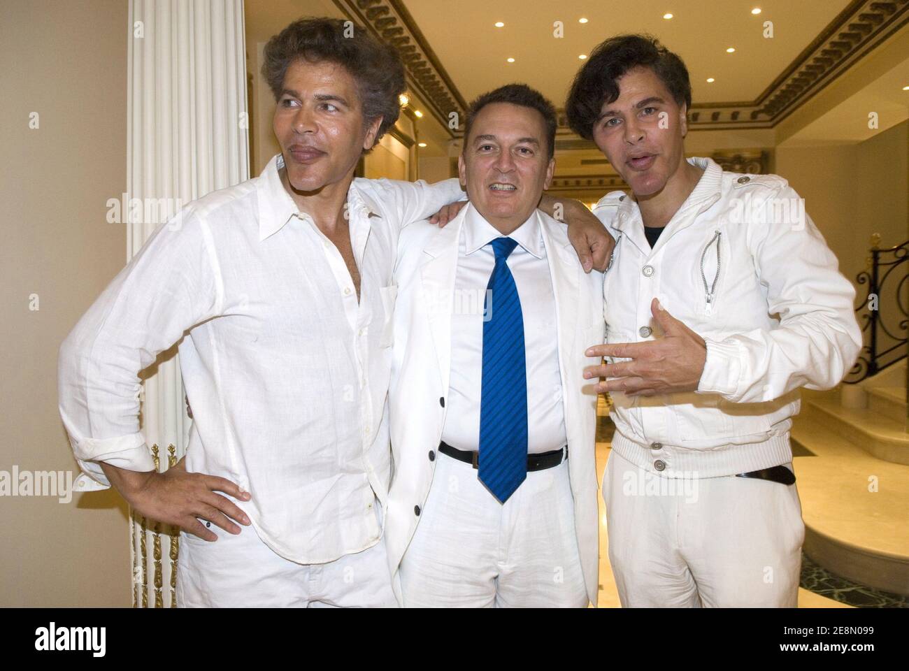 Igor Bogdanoff, Telemedia CEO Pierre Guillermo and Grichka Bogdanoff partying at the 'Soiree Blanche' organized by the best businessman of the year Pierre Guillermo in Paris, France on July 14, 2007. Photo by Helder Januario/ABACAPRESS.COM Stock Photo