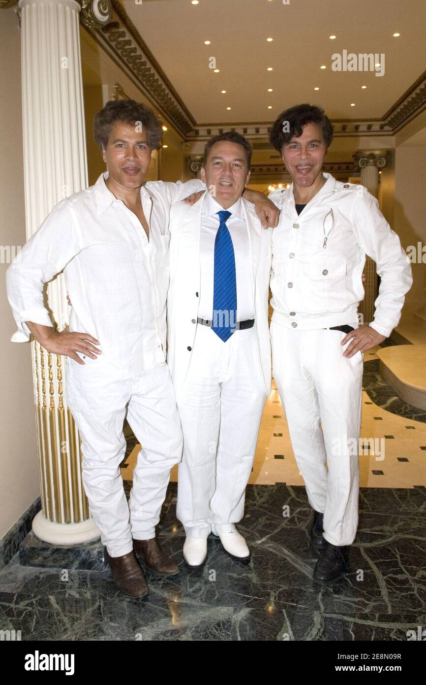 Igor Bogdanoff, Telemedia CEO Pierre Guillermo and Grichka Bogdanoff partying at the 'Soiree Blanche' organized by the best businessman of the year Pierre Guillermo in Paris, France on July 14, 2007. Photo by Helder Januario/ABACAPRESS.COM Stock Photo