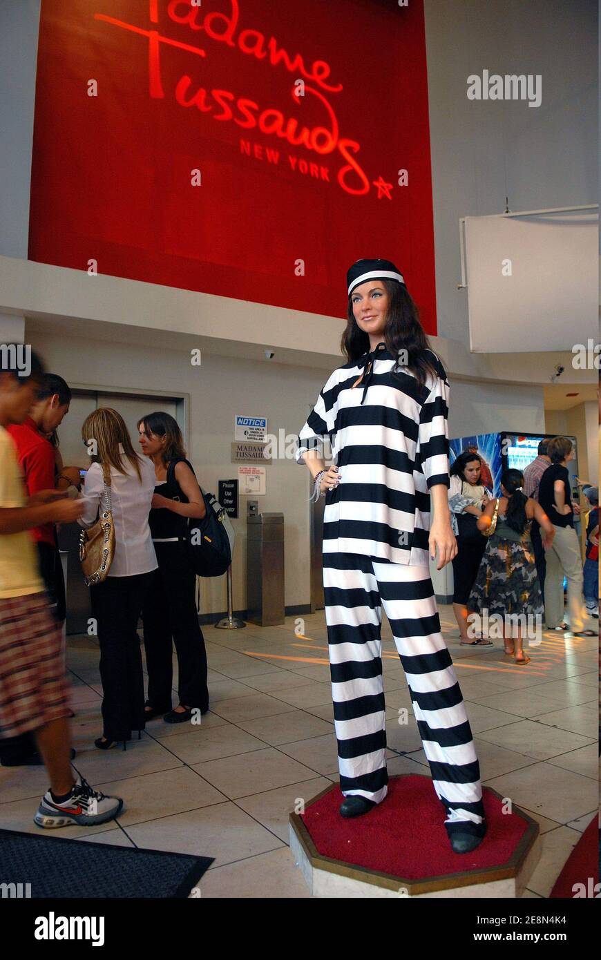 The wax figure of Lindsay Lohan wearing a black and white Jailbird costume to reflect her latest alleged arrest on drunk driving charges appears on display at Madame Tussauds Wax Museum in New York City, NY, USA on July 24, 2007. Photo by Graylock/ABACAPRESS.COM Stock Photo