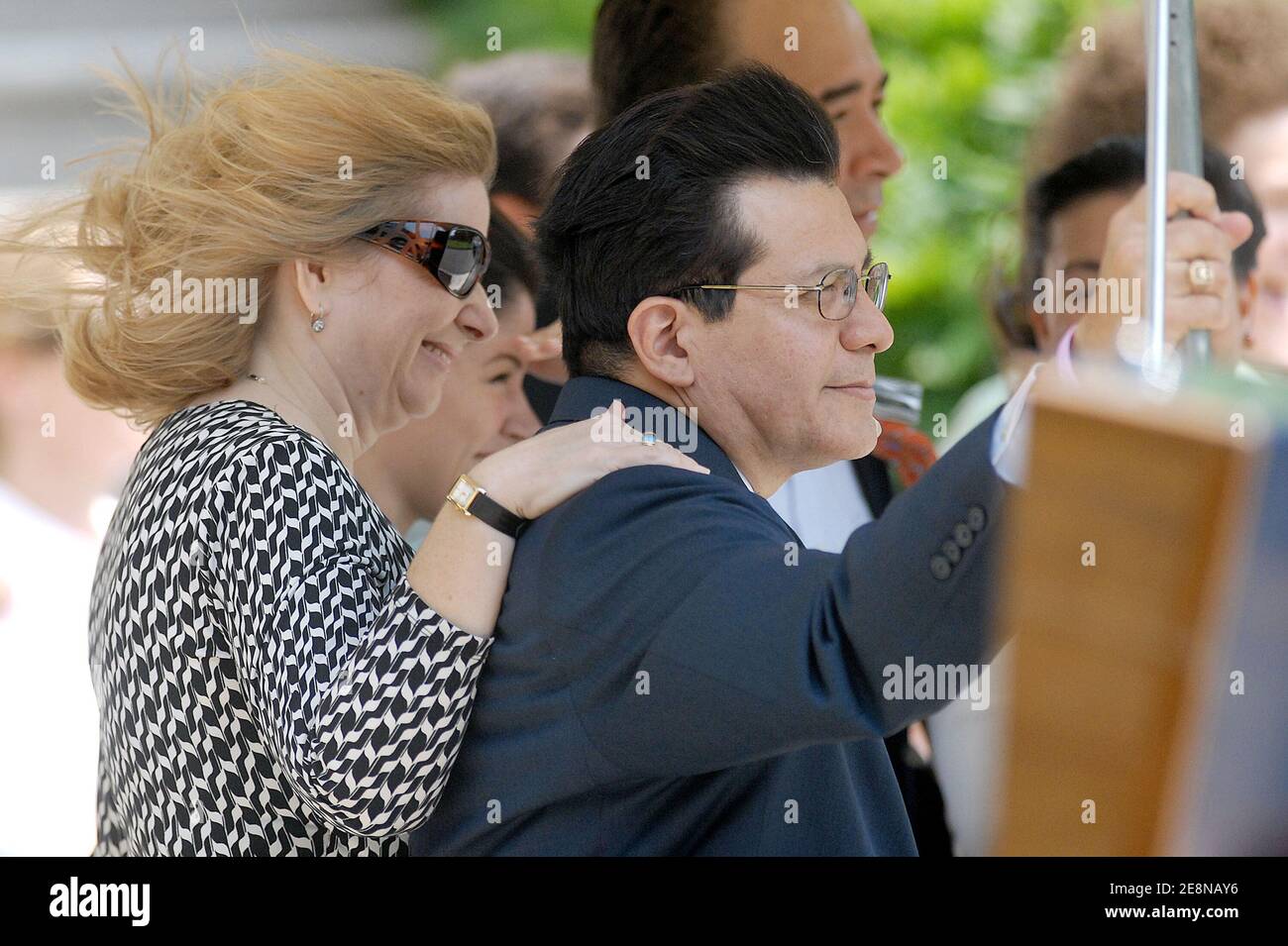 U.S. Attorney General Alberto Gonzales and his wife Rebecca watch as President George W. Bush departs from the White House, in Washington, DC, USA, on August 9, 2007. Bush will meet with French President Nicolas Sarkozy this weekend in Kennebunkport, Maine. Photo by Olivier Douliery/ABACAPRESS.COM Stock Photo