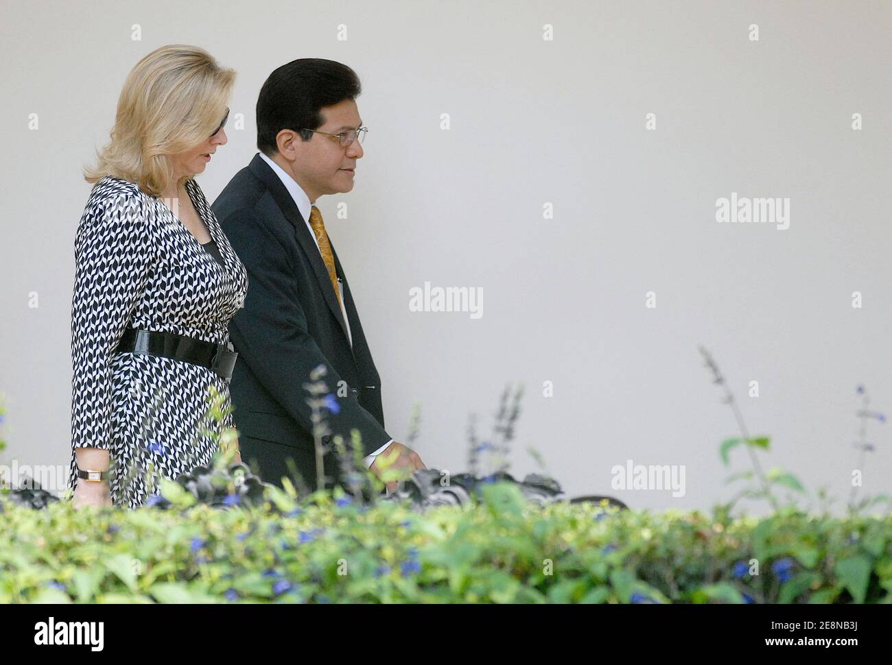 U.S. Attorney General Alberto Gonzales and his wife Rebecca walk in the White House, in Washington, DC, USA, on August 9, 2007. Bush will meet with French President Nicolas Sarkozy this weekend in Kennebunkport, Maine. Photo by Olivier Douliery/ABACAPRESS.COM Stock Photo