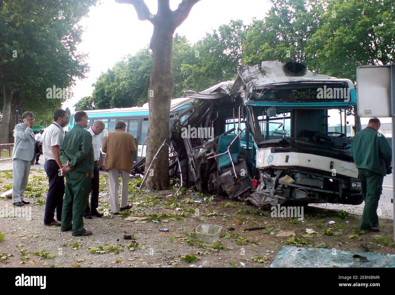 Police crash officers look at the scene after a Parisian RATP bus carrying more than 19 people was involved in a crash near 'Porte de la Villette' in Paris, France on August 13, 2007. 14 are wounded and three are seriously injured. Photo by ABACAPRESS.COM Stock Photo