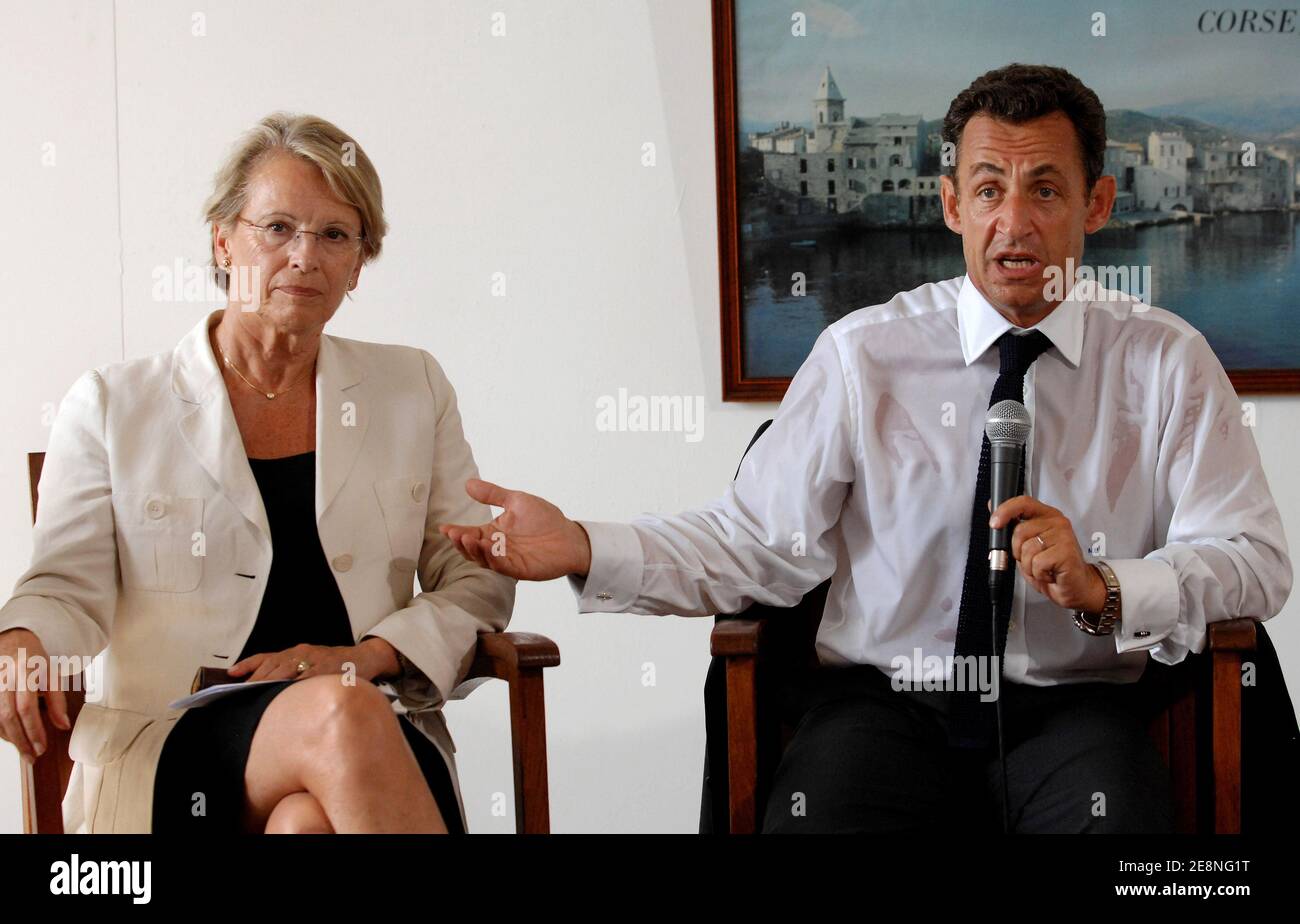 France's President Nicolas Sarkozy (R) flanked by Interior minister Michele Alliot-Marie, holds a press conference about extortion threats at Saint-Florent during a one-day visit to the French Mediterranean island of Corsica France, on August 28, 2007. Benvenuti is a local restaurant owner who claims to have received extortion threats. Photo by Christophe Guibbbaud/ABACAPRESS.COM Stock Photo