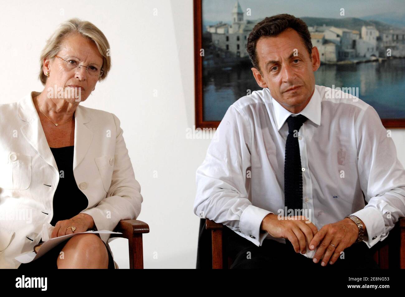 France's President Nicolas Sarkozy (R) flanked by Interior minister Michele Alliot-Marie, holds a press conference about extortion threats at Saint-Florent during a one-day visit to the French Mediterranean island of Corsica France, on August 28, 2007. Benvenuti is a local restaurant owner who claims to have received extortion threats. Photo by Christophe Guibbbaud/ABACAPRESS.COM Stock Photo
