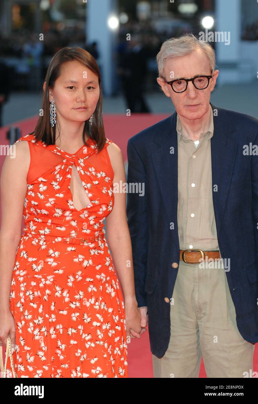 Director Woody Allen and his wife SoonYi Previn walk the red carpet
