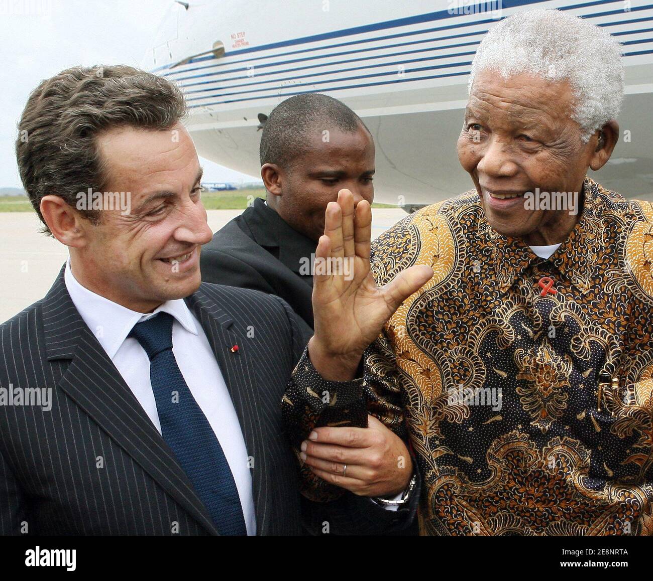 President Nicolas Sarkozy (l) welcomes former South African president Nelson Mandela upon his arrival at Orly airport, near Paris, France on September 3, 2007. The 89-year-old Nobel Peace Prize winner Mandela spent 27 years in prison before being freed in 1990, going on to become South Africa's first black leader in 1994 after the fall of apartheid. He received last week a hero's welcome in London, where a statue of him was unveiled opposite the Houses of Parliament. Photo by Thomas Coex/Pool/ABACAPRESS.COM Stock Photo