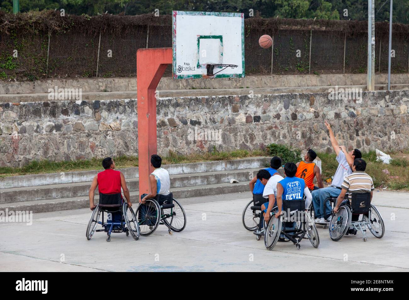 Antigua, Guatemala.  Disabled Young Men in Wheel Chairs Playing Basketball. Stock Photo