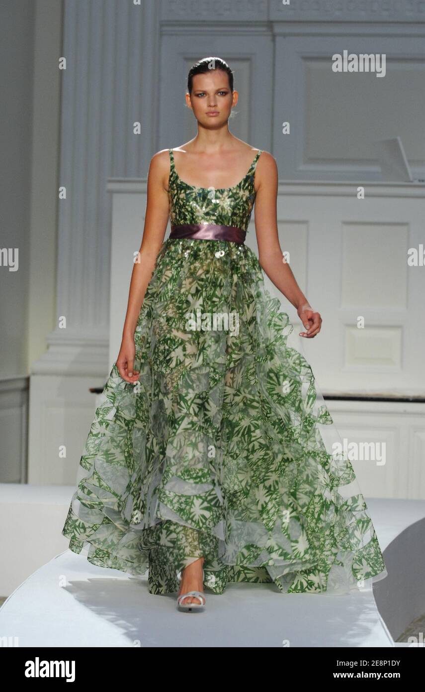 A model displays a creation by Oscar de la Renta during Mercedes