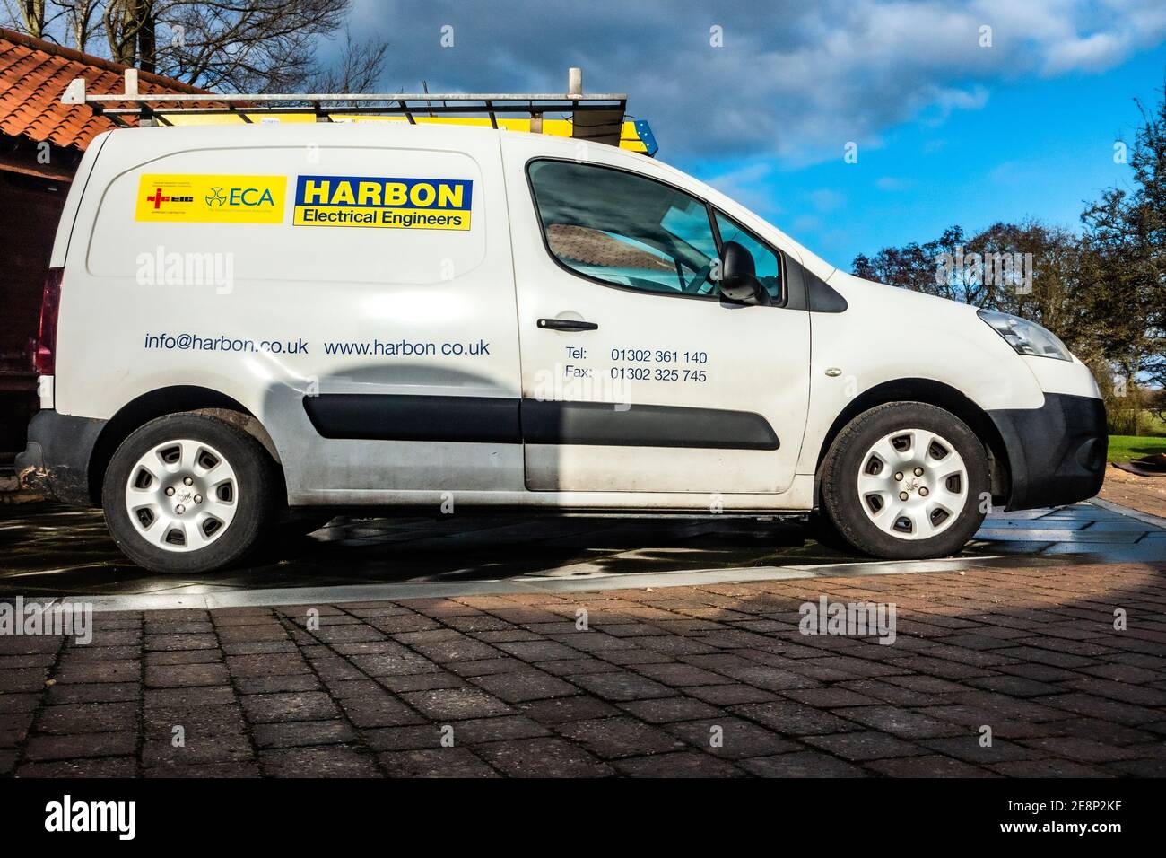 White electricians work van parked at. a private location Stock Photo