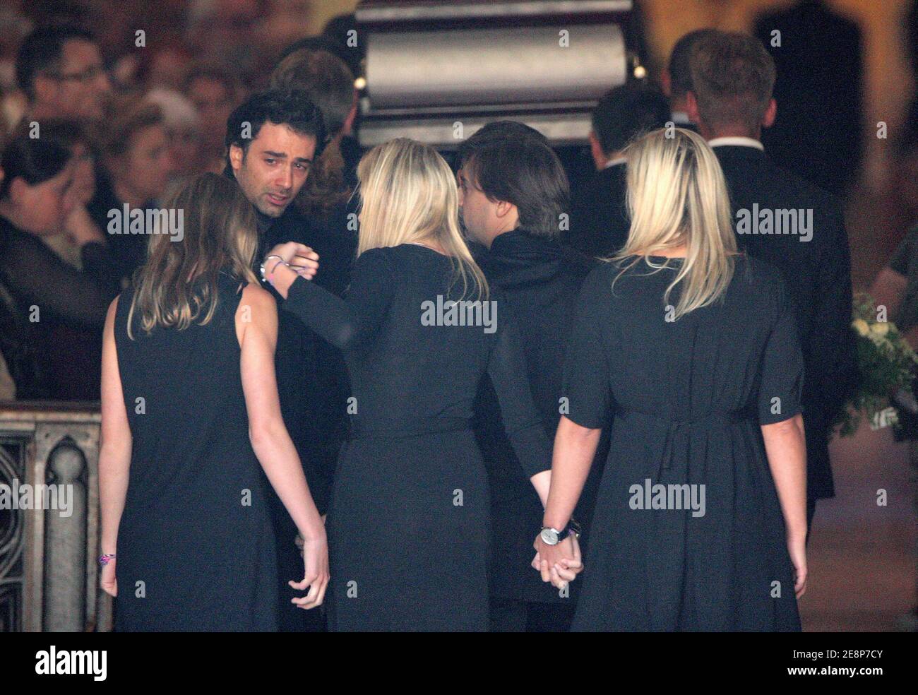 Jean-Baptiste Martin looks at his sisters, Juliette, Judith and Jeanne-Maris as they are following the coffin of their father, TV anchor Jacques Martin, inside Saint-Jean Cathedral, in Lyon, France on September 20, 2007. Photo by Bernard-Dargent-Khayat-Nebinger/ABACAPRESS.COM Stock Photo