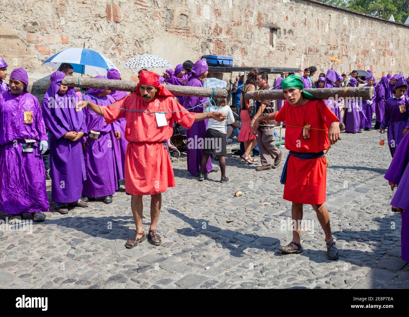 Antigua, Guatemala.  The Two Thieves, Marching to their Crucifixion.  Semana Santa Procession. Stock Photo