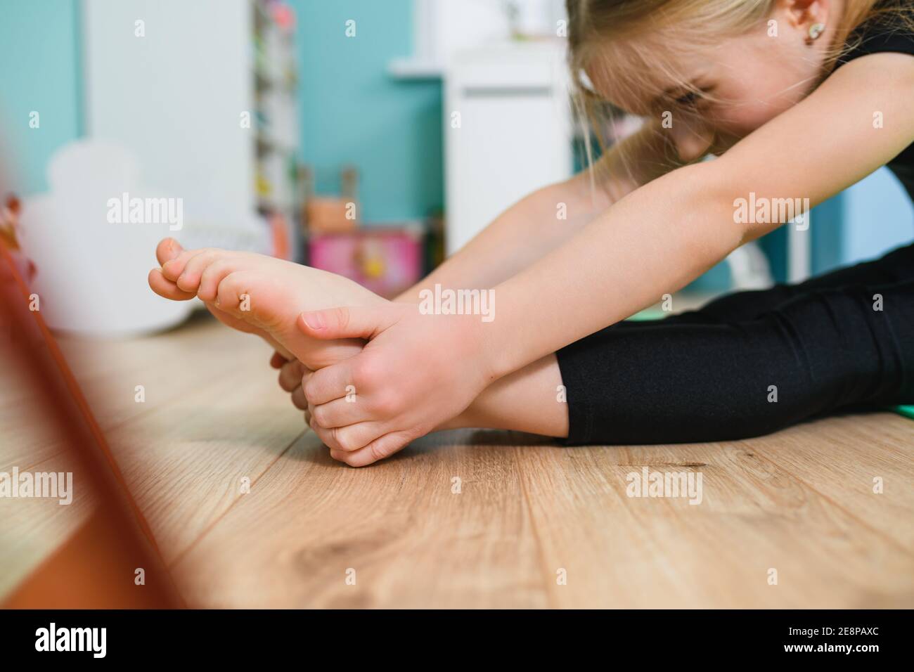Close Up Small Gymnast Girl Hands And Feet During Stretching Workout On 