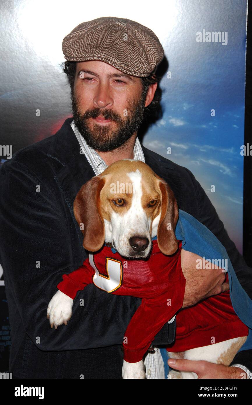 Actor Jason Lee poses with Leo the dog who plays Underdog in the film