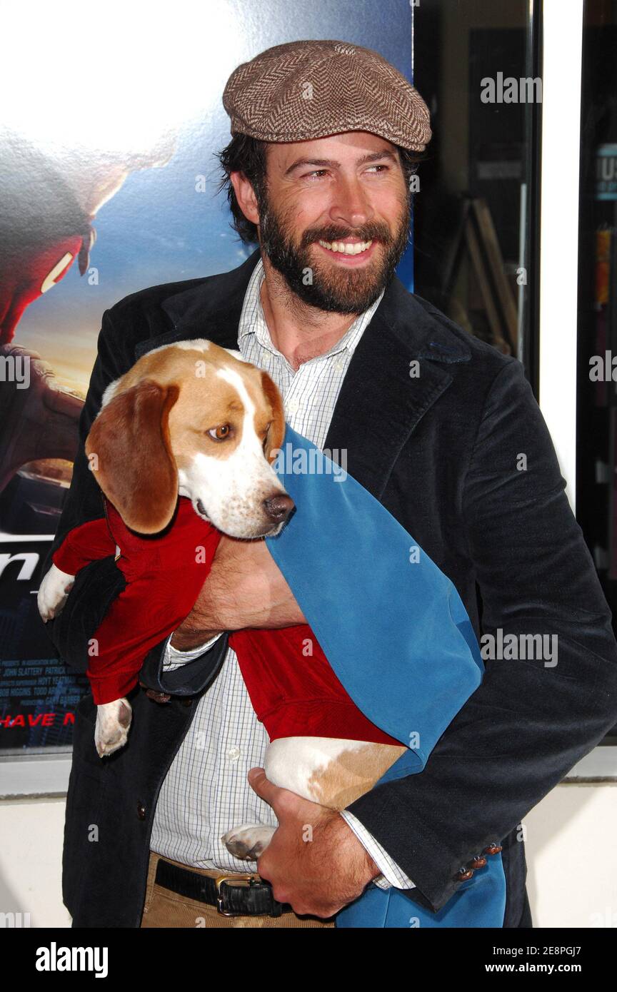 Actor Jason Lee poses with Leo the dog who plays Underdog in the film