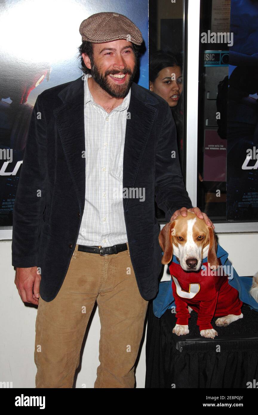 Actor Jason Lee poses with Leo the dog who plays Underdog in the film