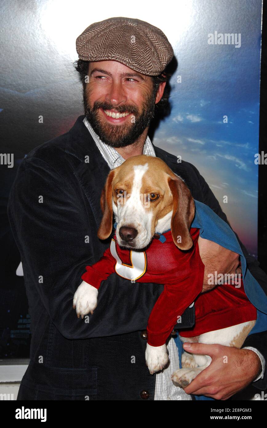 Actor Jason Lee poses with Leo the dog who plays Underdog in the film