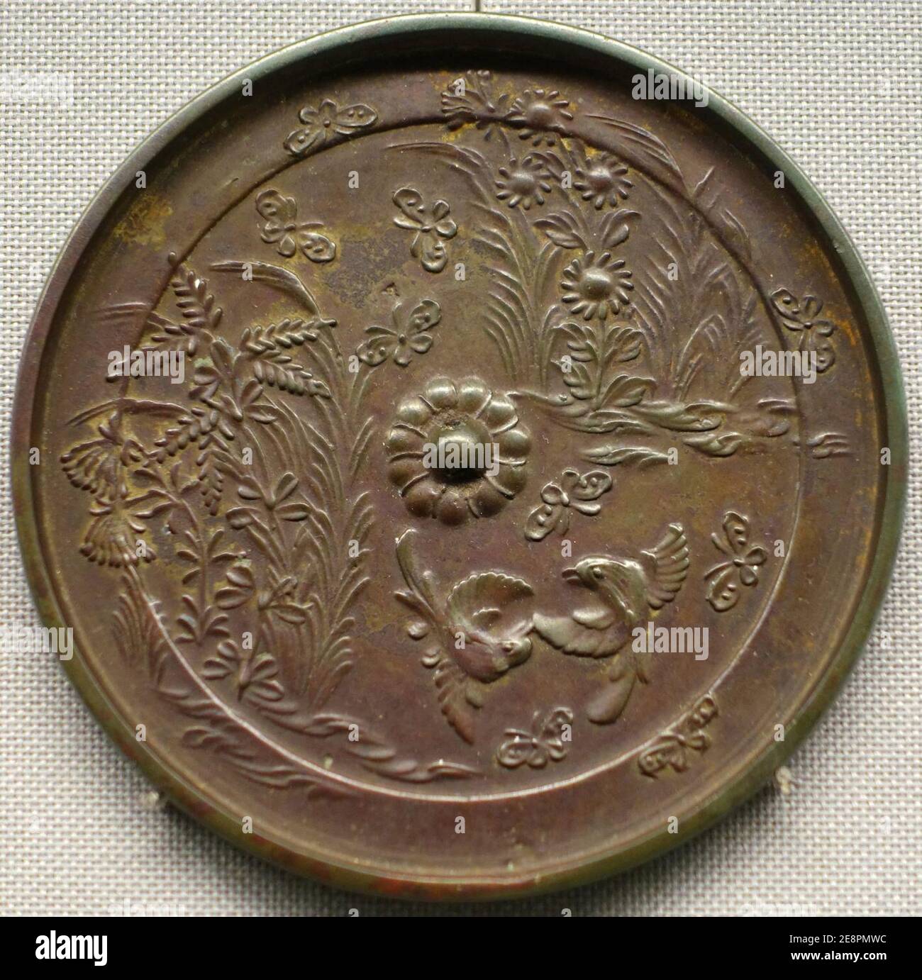 Mirror with autumn plant, butterfly, and bird design, Hakusan Jinja Sutra Mound, Nakayama, Hachioji-shi, Tokyo, Heian period, 1100s AD, bronze Stock Photo