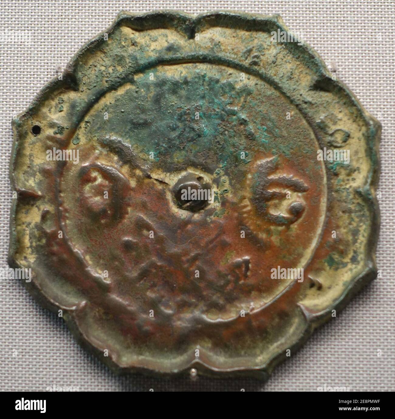 Mirror with flower and paired birds design, excavated at Hakusan Jinja Sutra Mound, Nakayama, Hachioji-shi, Tokyo, Heian period, 1100s AD, bronze Stock Photo