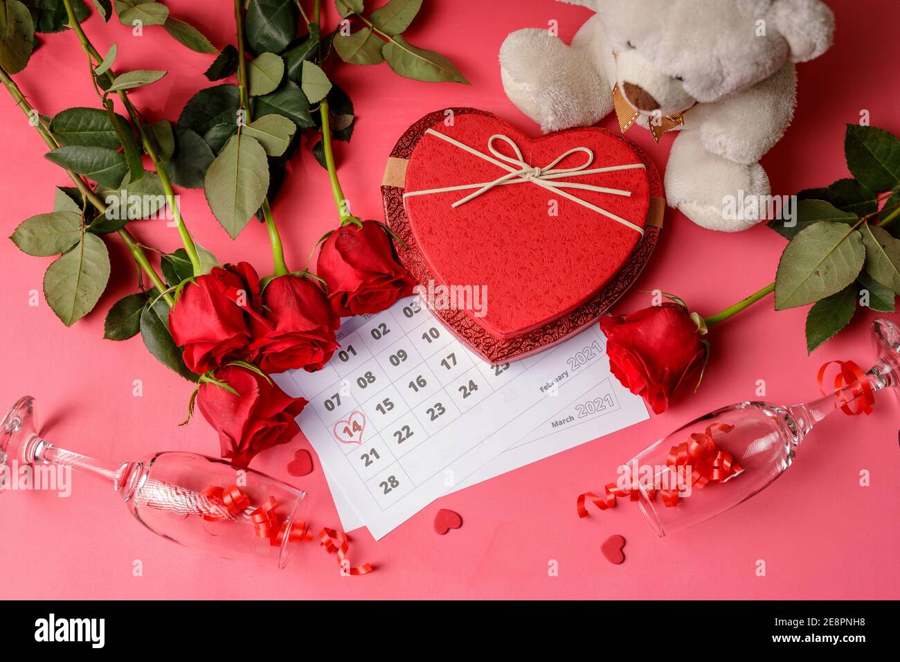 Valentine day. Red hearths and roses on Calendar page. February 14 of Saint  Valentines day. Pink background Stock Photo - Alamy