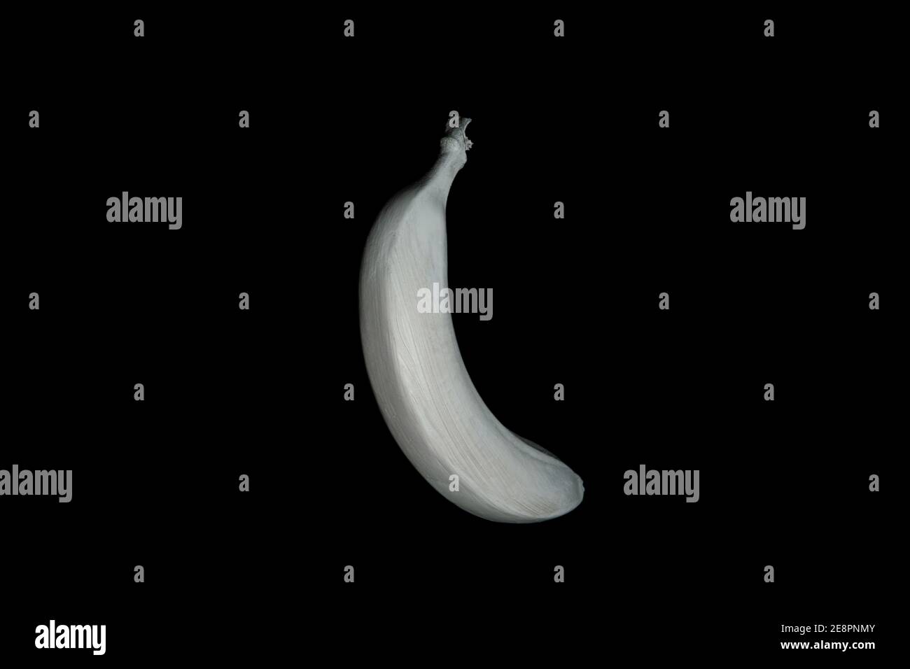 White floating banana on a black background. Creative fruit concept Stock Photo