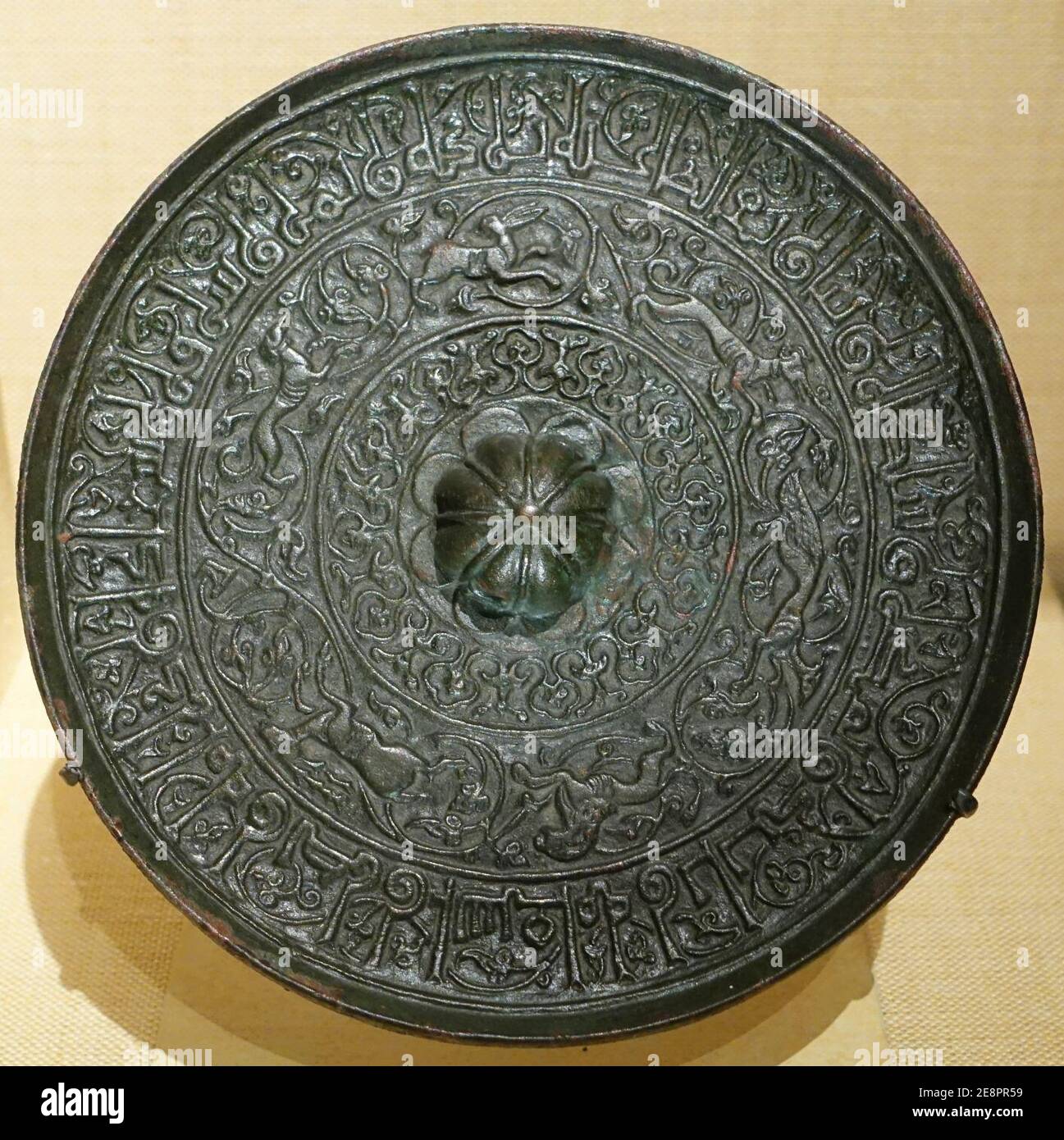 Mirror inspired by Chinese models, Iran, Seljuq period, 1100s AD, bronze, 42.136 Stock Photo
