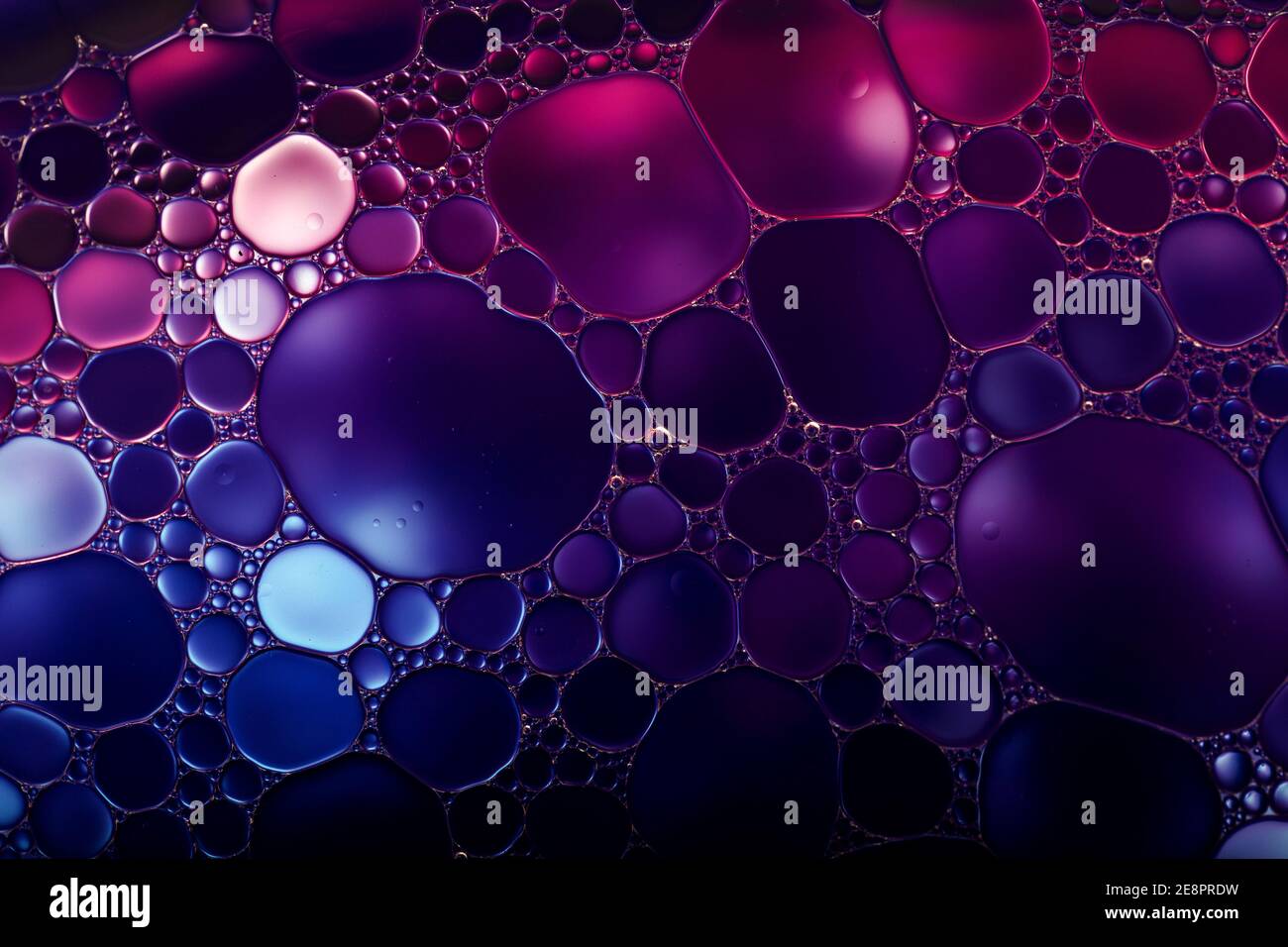 Oil drops on a water surface. Abstract and background. Stock Photo