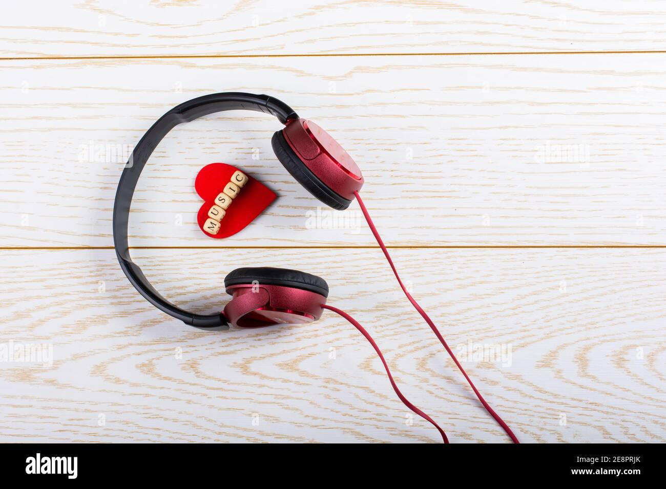 Red Headset Heart Rythm Design Red headphones and music written red heart on a wooden background Stock ...