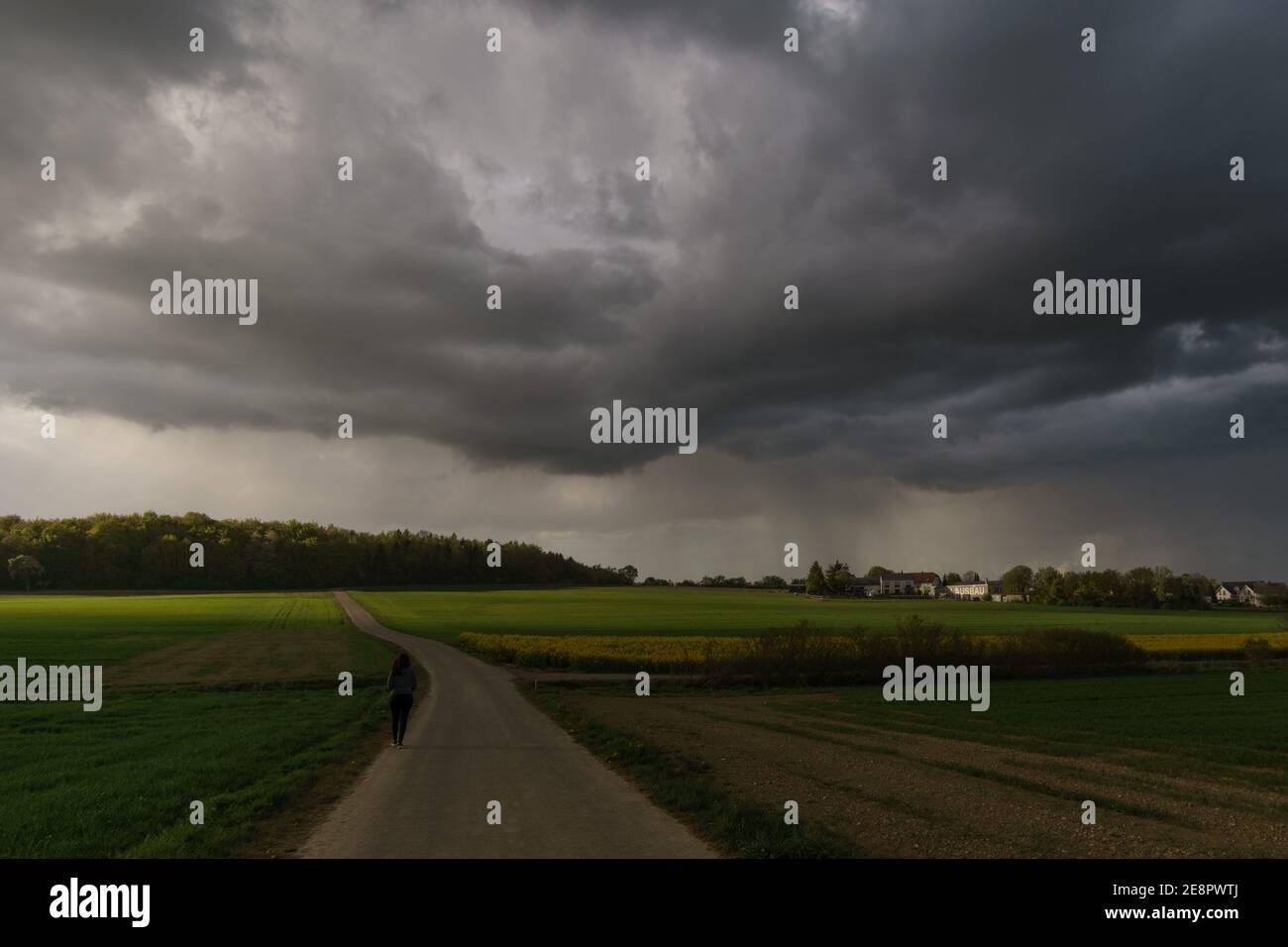 rural landscape at wild changing stormy weather condition with rain and sun Stock Photo