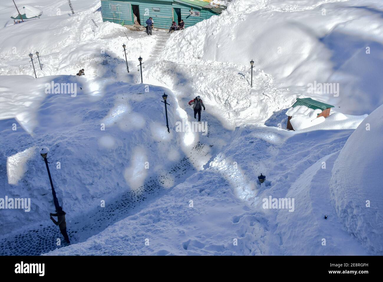 Gulmarg, India. 31st Jan, 2021. Indian tourists enjoy the ride on snow sledges during a sunny winter day. Chillai-kalan', the harshest 40-day winter period in Kashmir, ended on Sunday, breaking a decades-old record as Srinagar registered 8.8 degrees Celsius temperature in 30 years, officials said. The weatherman has forecast light rain and snow in the next 24 hours. Credit: SOPA Images Limited/Alamy Live News Stock Photo