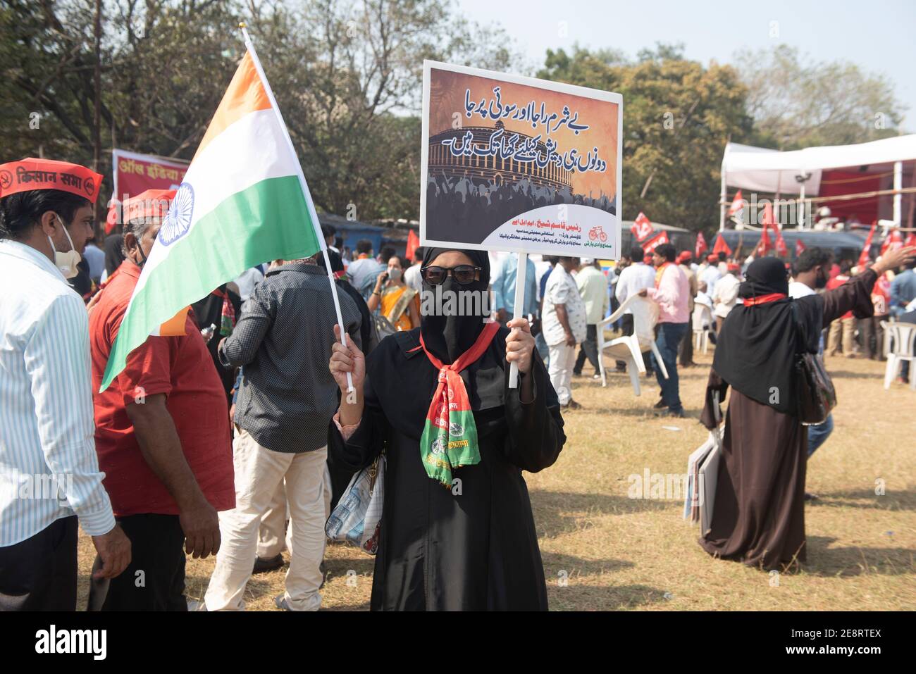Mumbai , India - 25 January 2021, Muslim woman activists protesters in a black burqa hold up indian flag and signs in a rally at the Azad Maidan again Stock Photo