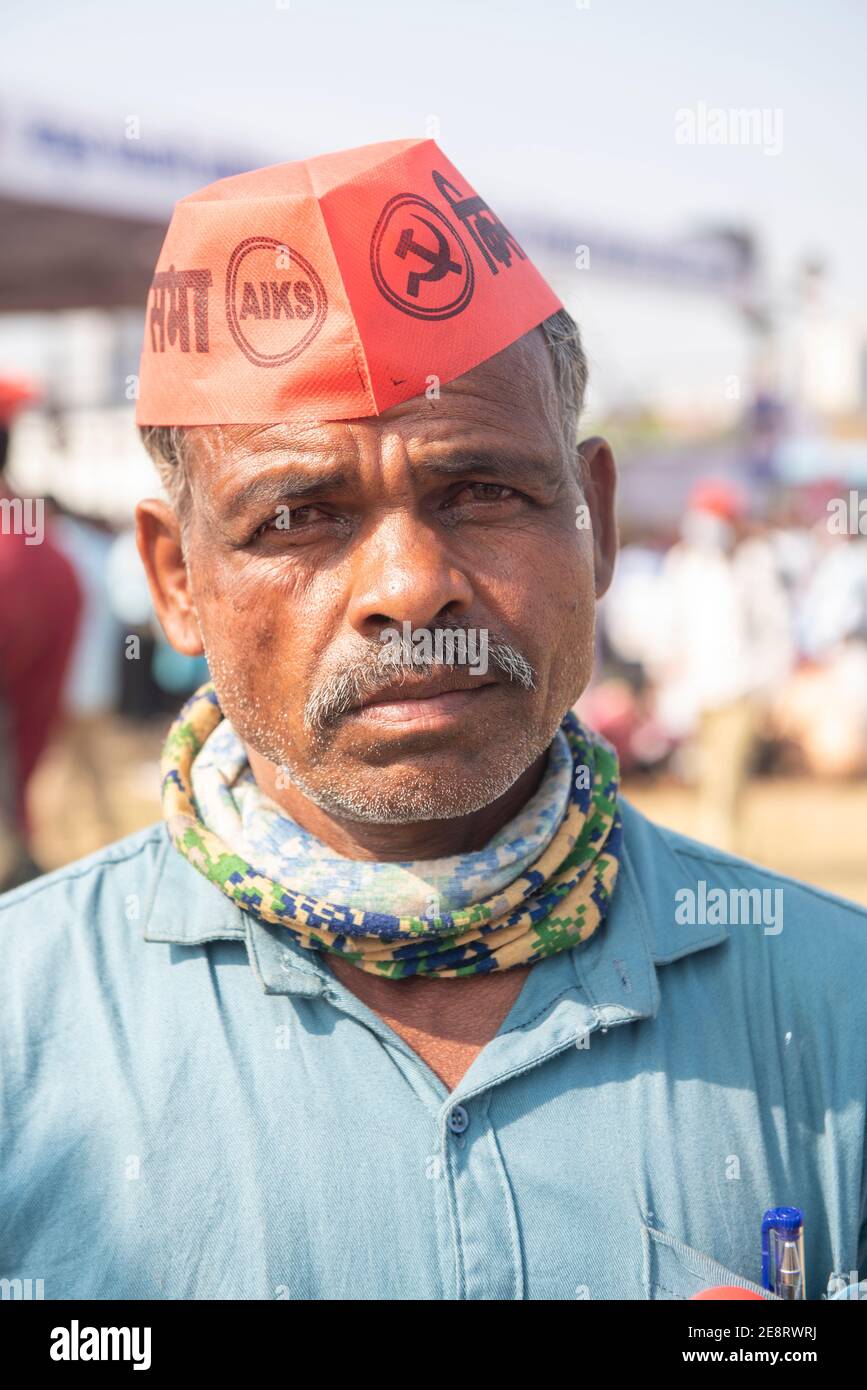 Mumbai , India - 25 January 2021, Portrait of a elderly rural man wearing red cap in a rally at the Azad Maidan against the three new farm laws Stock Photo