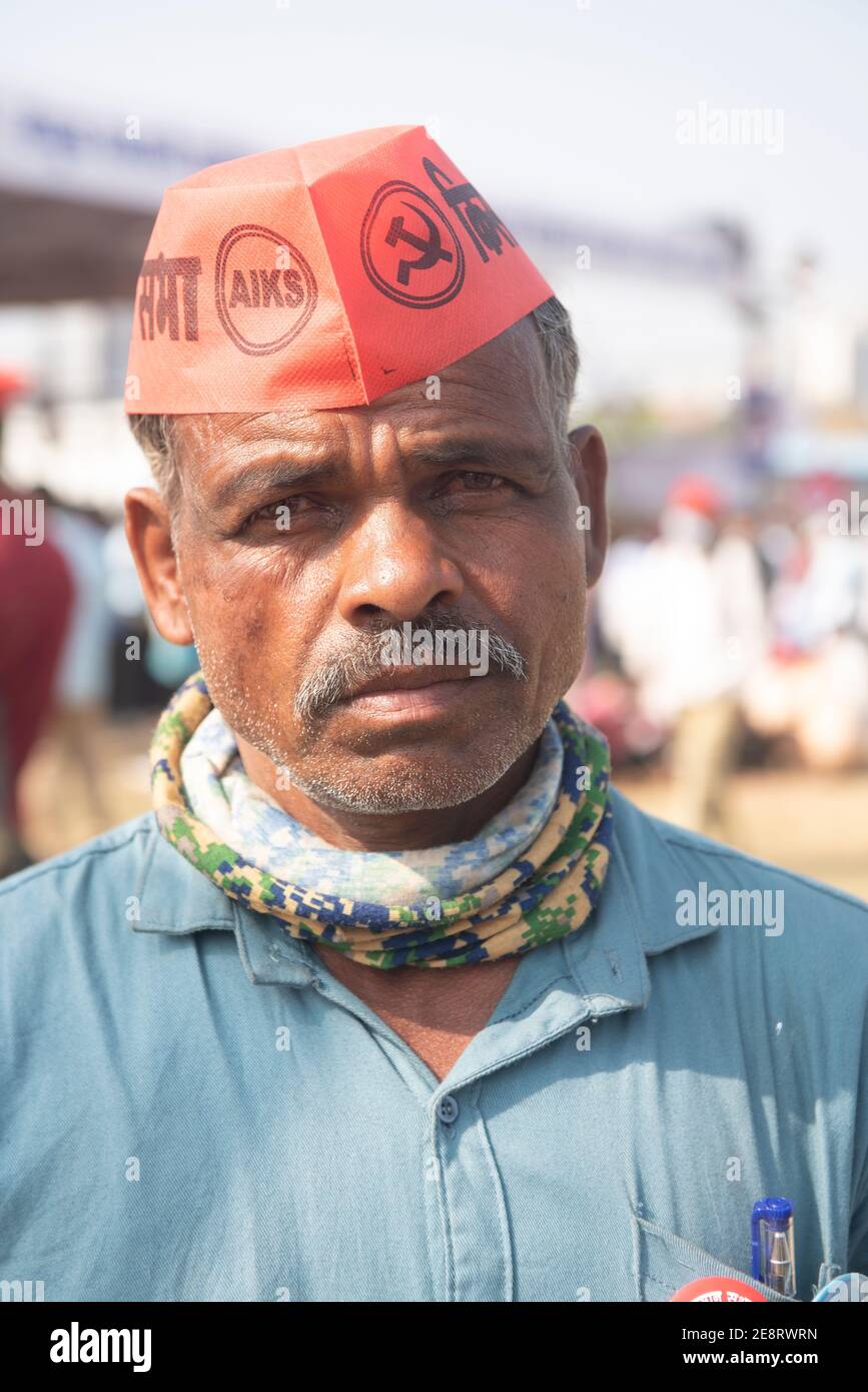 Mumbai , India - 25 January 2021, Portrait of a elderly rural man wearing red cap in a rally at the Azad Maidan against the three new farm laws Stock Photo