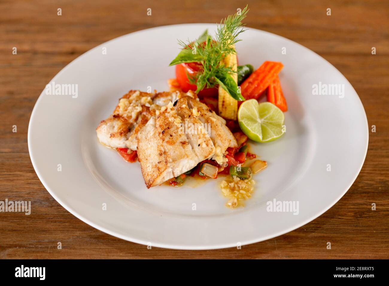 Fillet sea bass meuniere with vegetable and potatoes Stock Photo Alamy