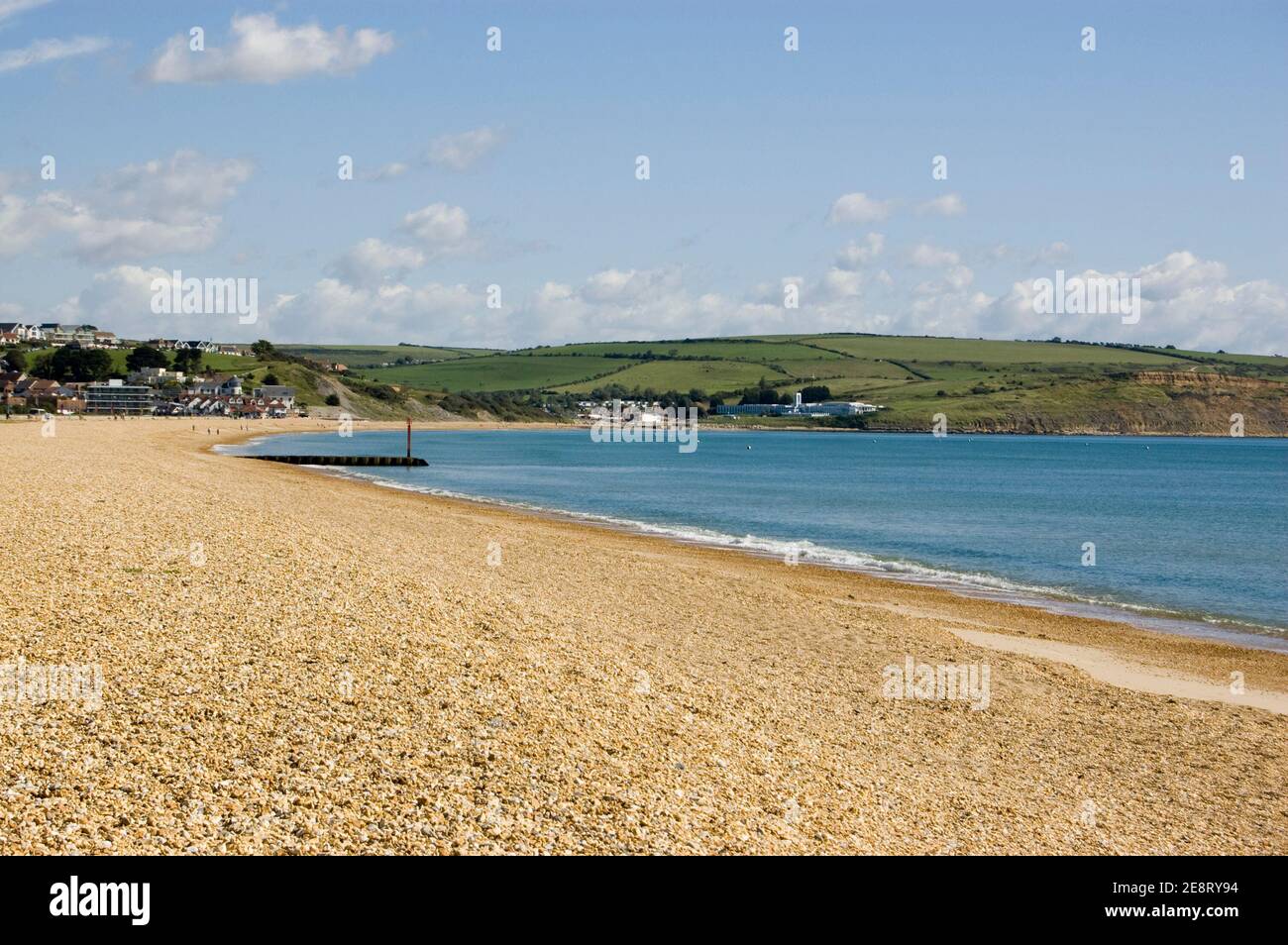 View looking north along the shingle Preston Beach at the seaside resort of Weymouth, Dorset. Stock Photo