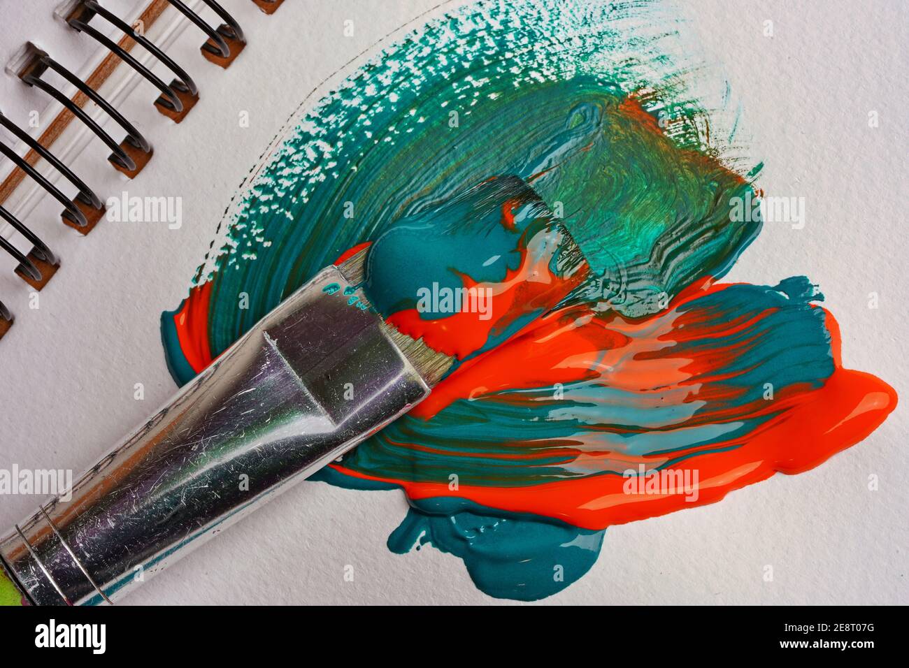 Brush when mixing paint on paper, macro shot Stock Photo