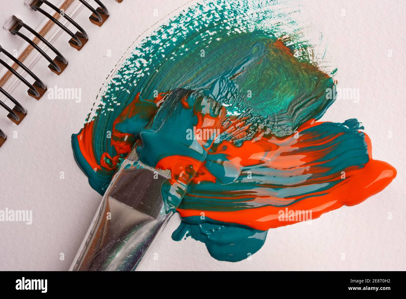 Brush when mixing paint on paper, macro shot Stock Photo