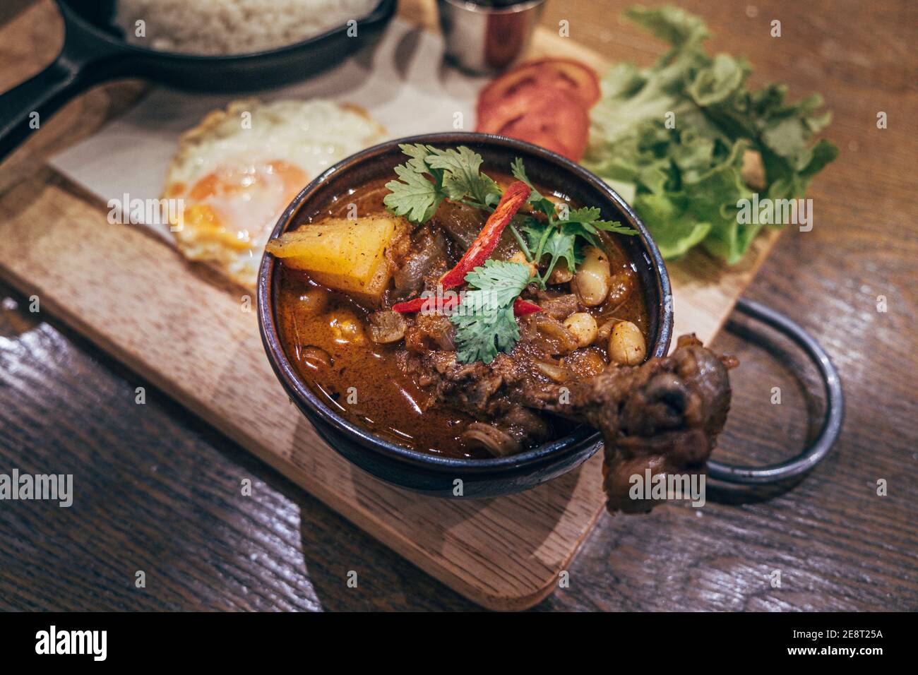 Thai Indian  best dish  Massaman Curry with Chicken and Potatoes is influenced by Malay and Thai Muslim cultures Stock Photo