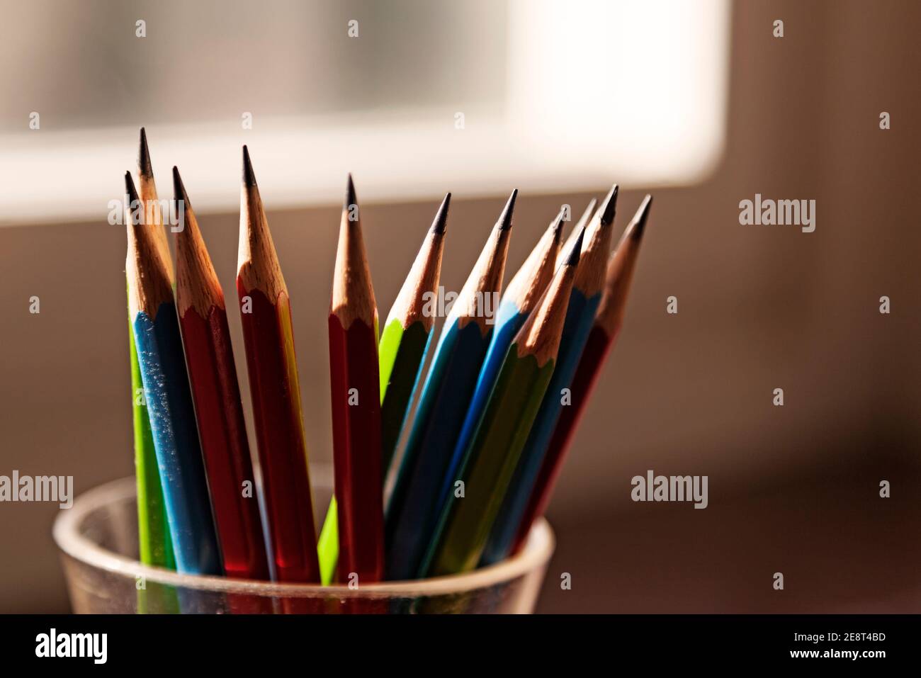 several pencils in backlight by window Stock Photo