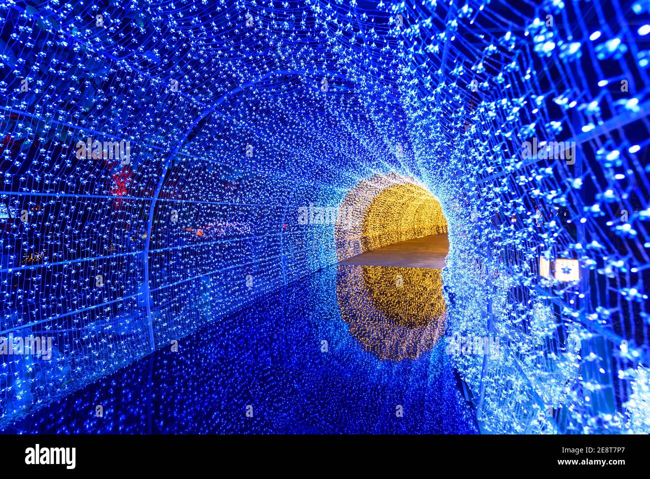 blue lighting tunnel with reflection on ground Stock Photo