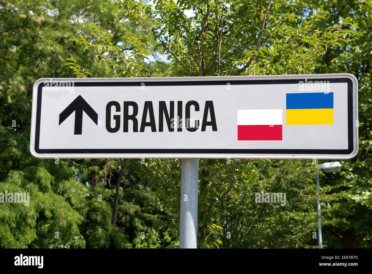 A road sign and border between Poland and Ukraine Stock Photo