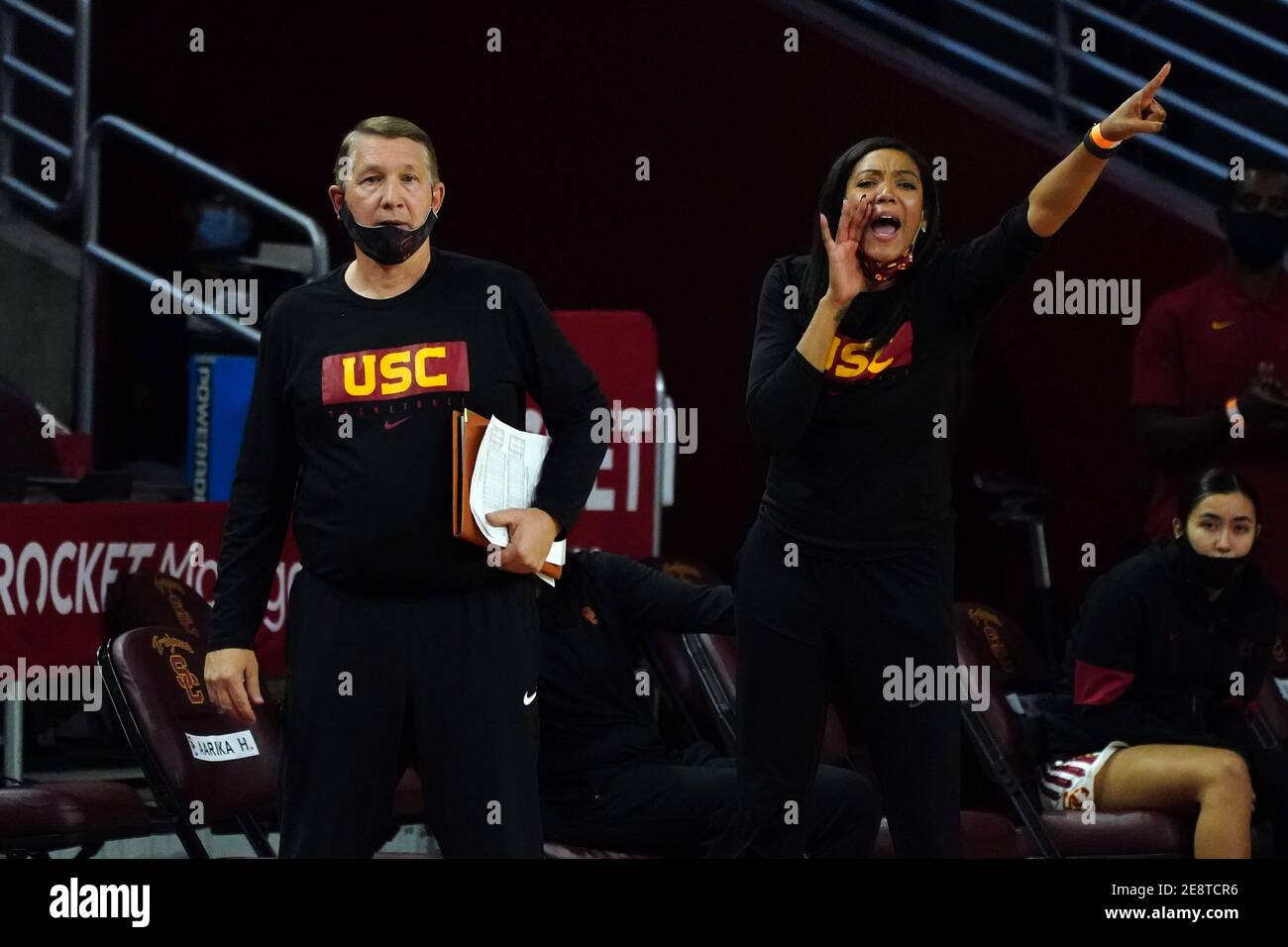 Southern California Trojans associate coaches Jason Glover (left) and Aarika Hughes react during an NCAA college women's basketball game against the A Stock Photo
