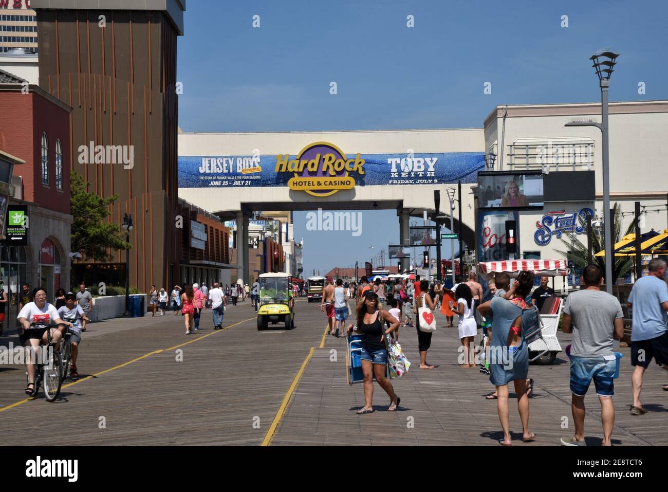 ATLANTIC CITY, NEW JERSEY, USA - JUNE 26, 2019: Tourists enjoying the Atlantic City Boardwalk by the Hard Rock Hotel and Steel Pier Stock Photo