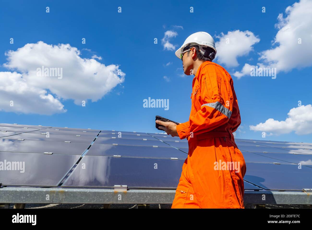 The solar farm(solar panel) with engineers walk to check the operation