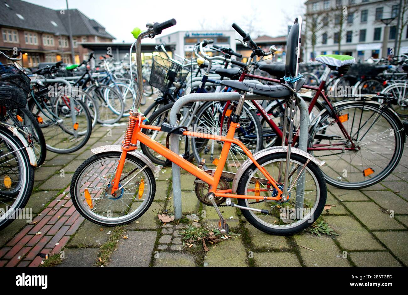 Oldenburg, Germany. 28th Jan, 2021. A so-called Bonanza bike as well as  numerous other bicycles stand on the forecourt at the main station.  Originating from the American West Coast, these bicycles, designed