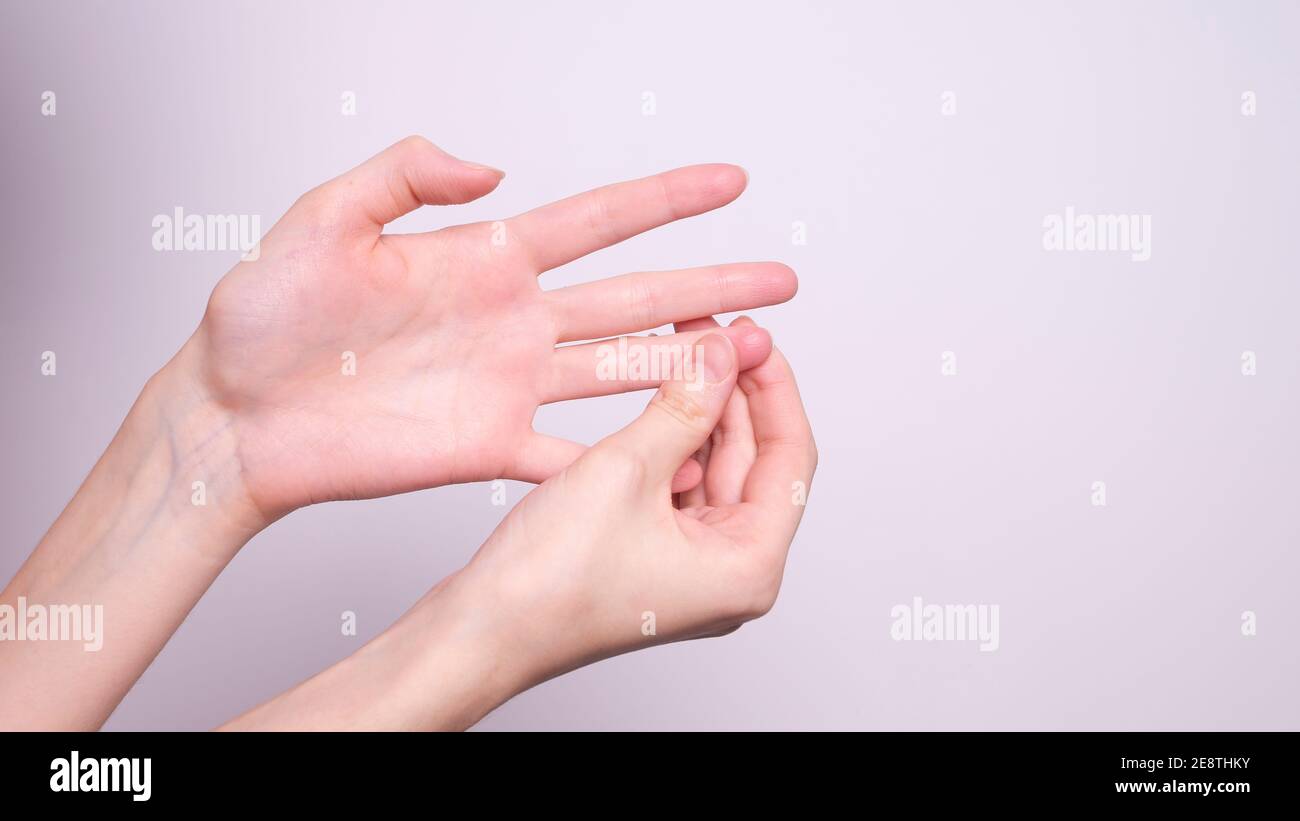 Parkinson's disease symptoms. Close up of tremor (shaking) hands of