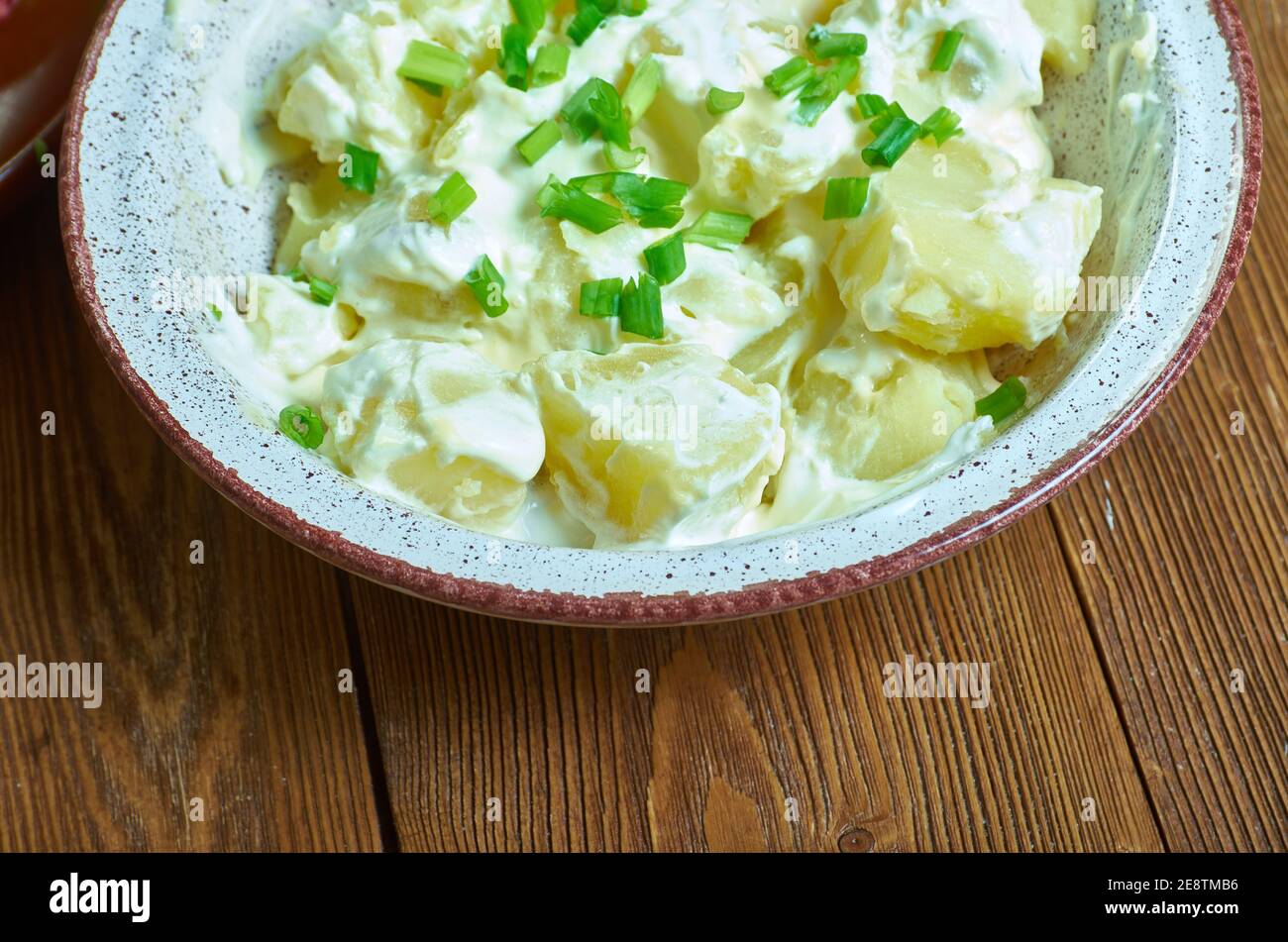 Irish Potato Salad, Cut and steam the potatoes until tender Stock Photo
