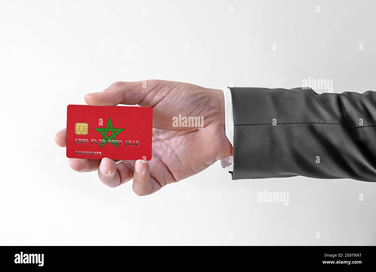 Bank credit plastic card with flag of Morocco holding man in elegant