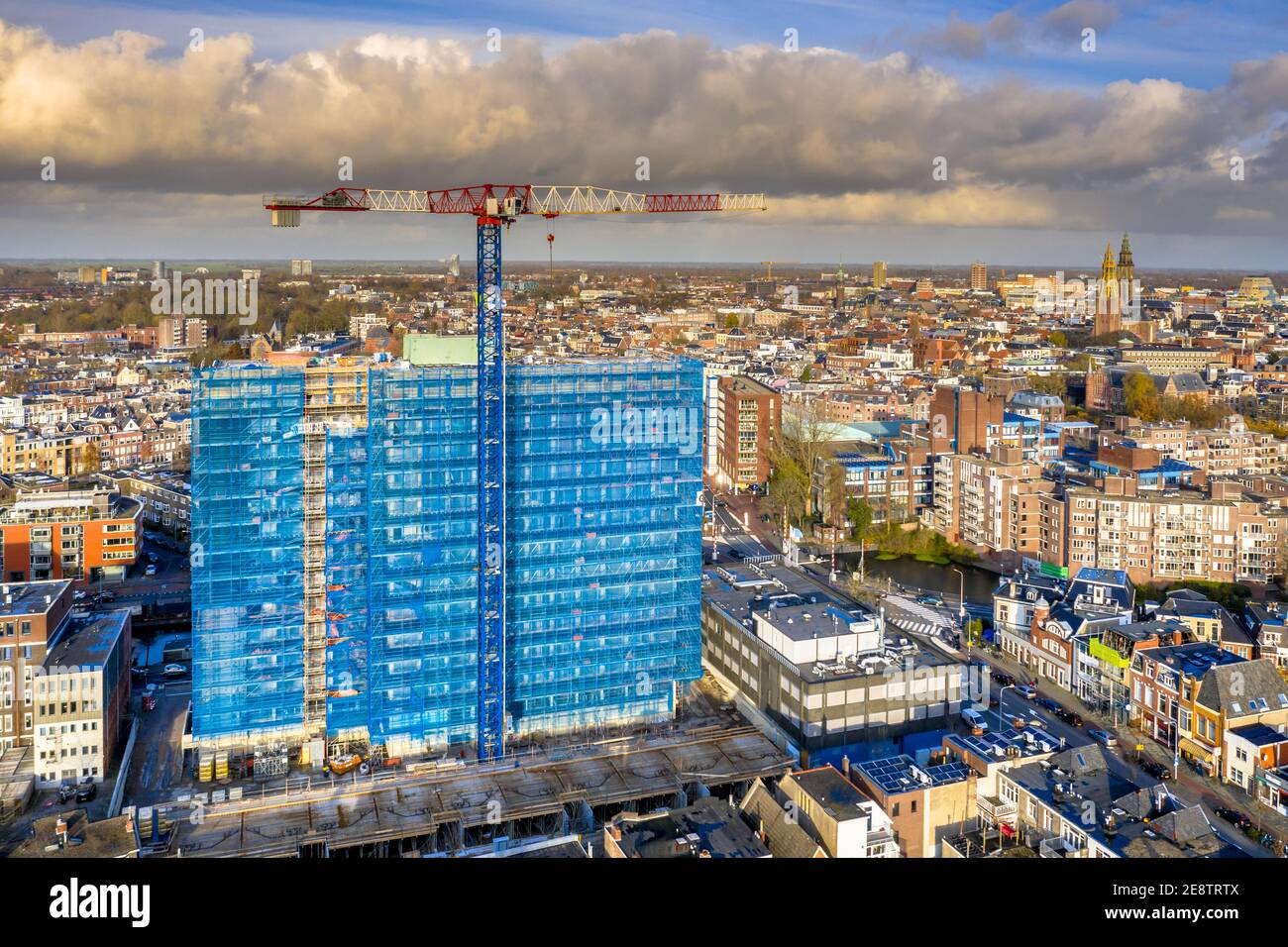 Aerial view of construction crane building high rise apartment building